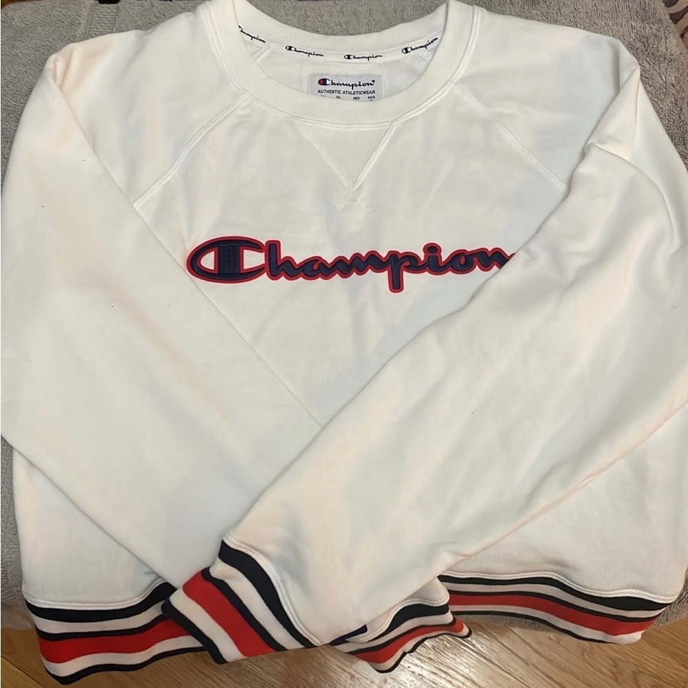 Brand new with tags womans small champion sweatshirt. Shorter cut. Adorable
